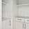 a kitchen with white cabinets