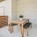 a table and chairs outside a house