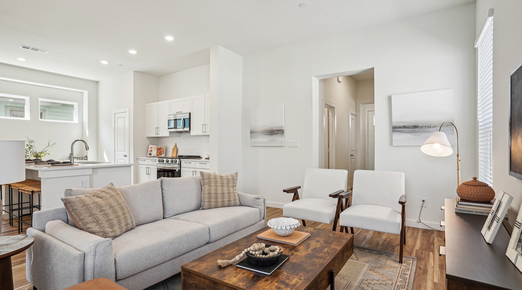 Gorgeous living areas to entertain and enjoy Spacious room with a couch and windows