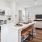 a kitchen with white cabinets