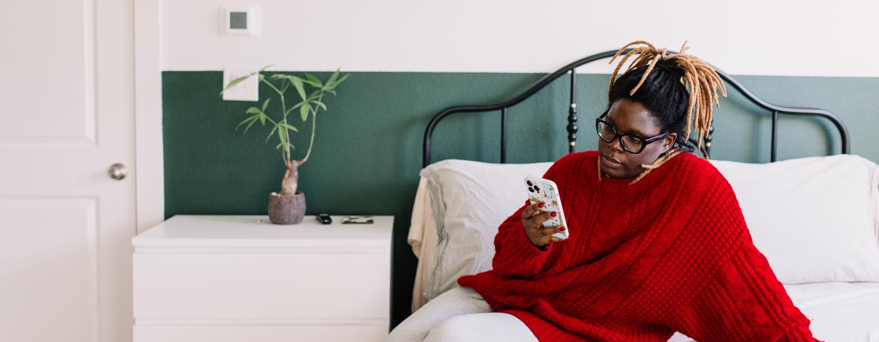 a person sitting on a bed