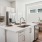 a kitchen with white cabinets