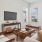 a living room with a tv and couches