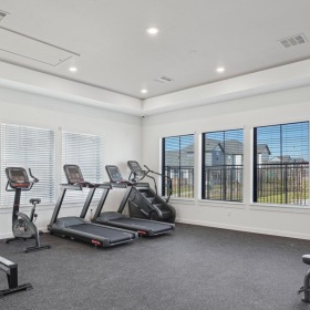Meet your fitness goals just steps away from your front door a gym with exercise equipment